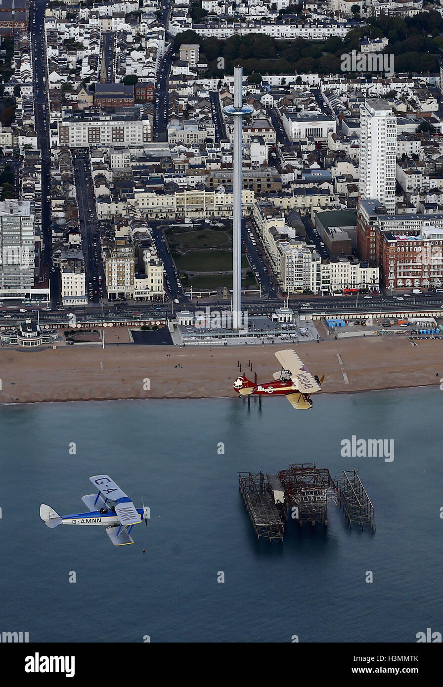 EMBARGOED TO 1030 TUESDAY OCTOBER 11 An English Tiger Moth DH82A (left) and a Canadian Travel Air 4000 fly over Brighton in East Sussex during a photo call for vintage bi-planes before the announcement of an 8,000+ mile Vintage Air Rally. The aviation adventure, across Africa with 10 international teams, will recreate the pioneering days of flight from the 1920s testing the pilots skills and aircraft, while raising funds for charity. Stock Photo