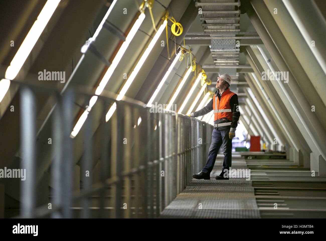 Iain Cookson, construction manager for the Queensferry Crossing centre tower, undertaking an inspection inside a section of the road deck as the new bridge over the Firth of Forth has officially entered the record books. Stock Photo