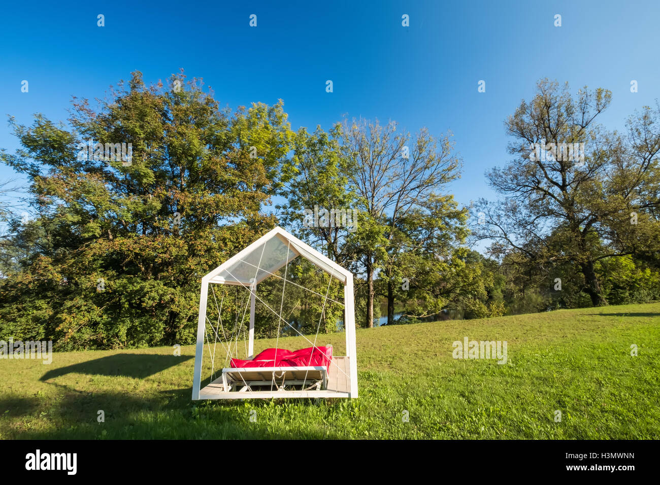 Mattress under a canopy in  the gardens at Big Berry lifestyle glamping resort at Kolpa river Slovenia Stock Photo