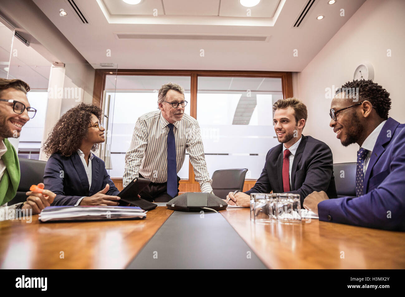 Business team having discussion at boardroom table meeting Stock Photo
