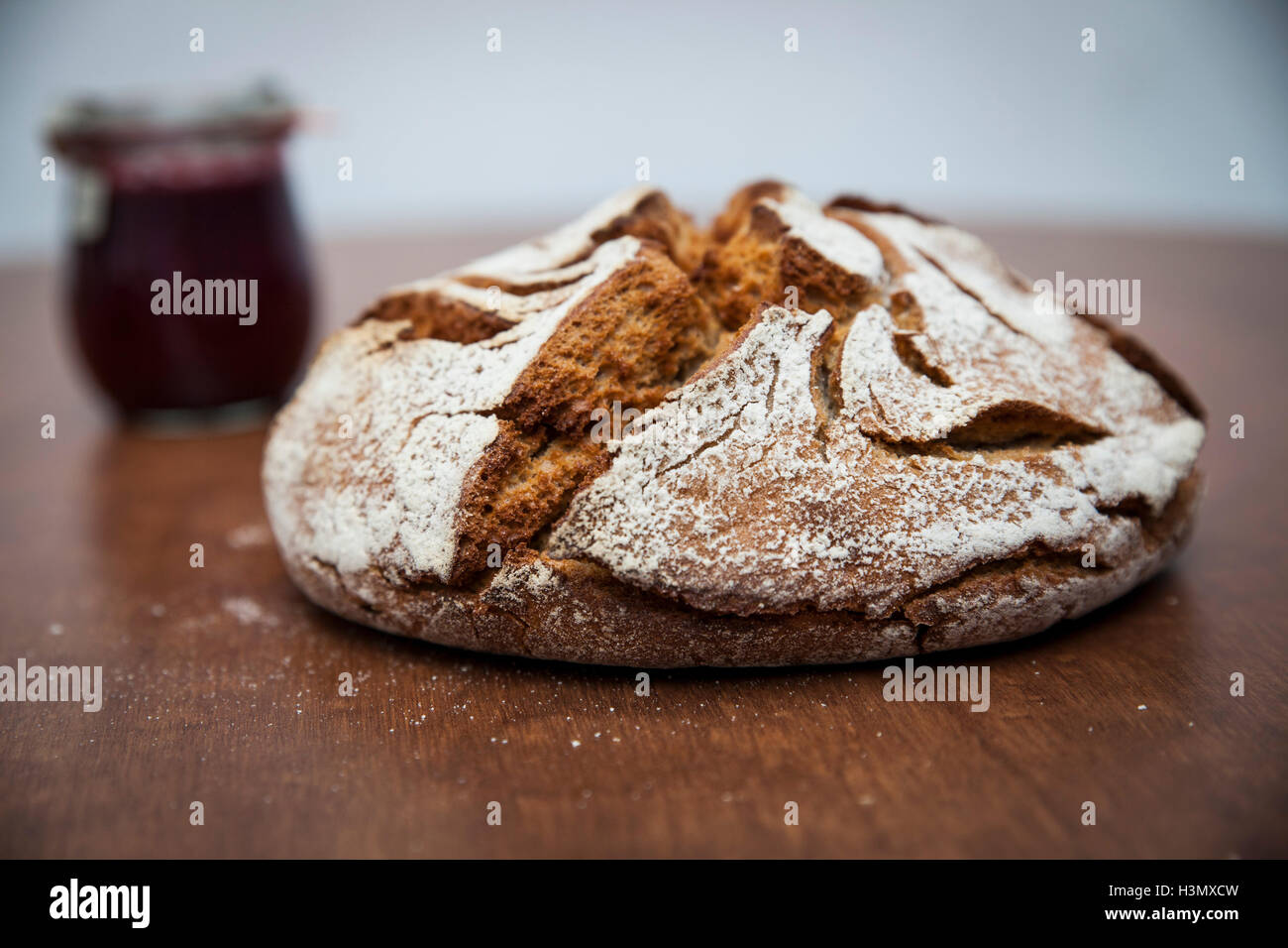 Rye bread (Roggenbrot) and jam on wooden table Stock Photo Alamy