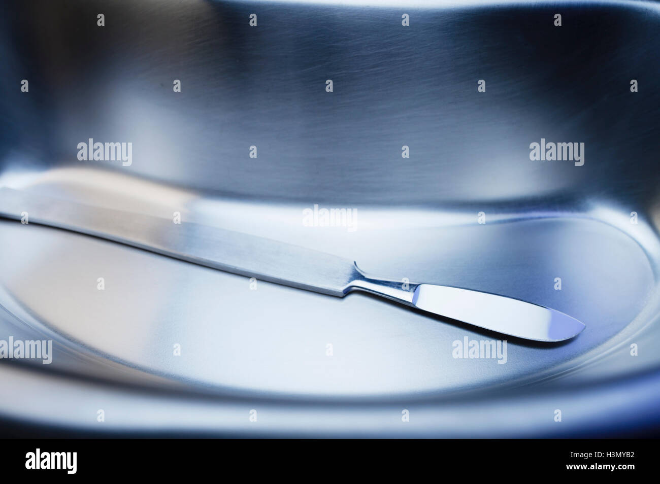 Scalpel in stainless steel kidney dish Stock Photo