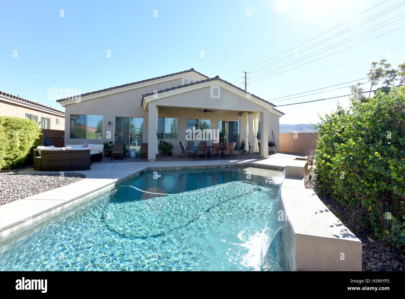 Residential home with backyard swimming pool Stock Photo