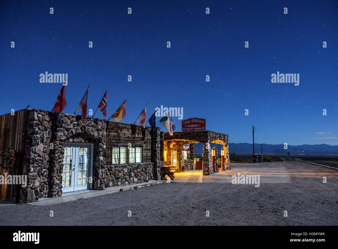 Night sky with many stars above rebuilt Cool Springs station in the Mojave desert on historic route 66 in Arizona Stock Photo