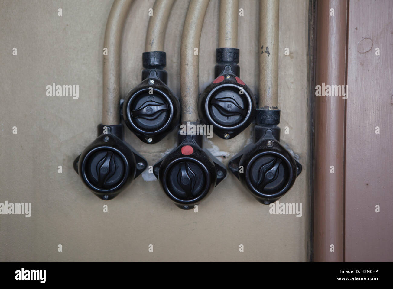 Power switch with wires on wall. Stock Photo