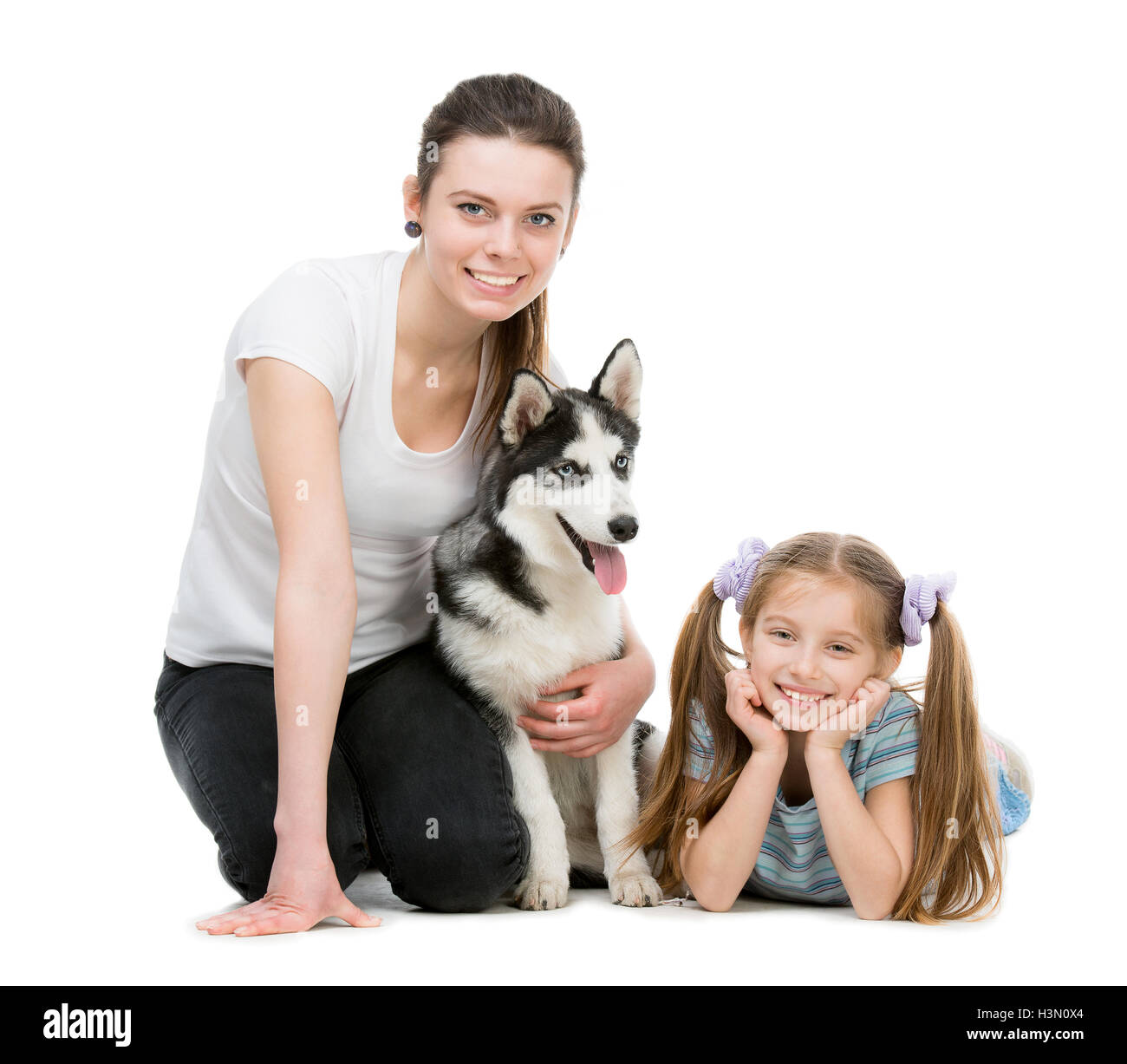 two sisters and a husky dog Stock Photo - Alamy