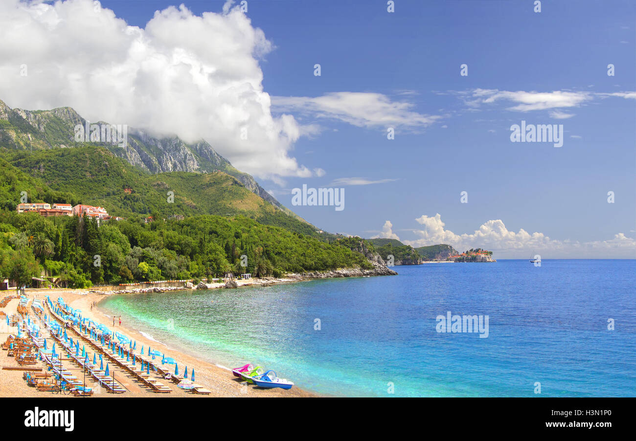 The beach of Budva Riviera overlooking the island of Sveti Stefan. Montenegro. Stock Photo