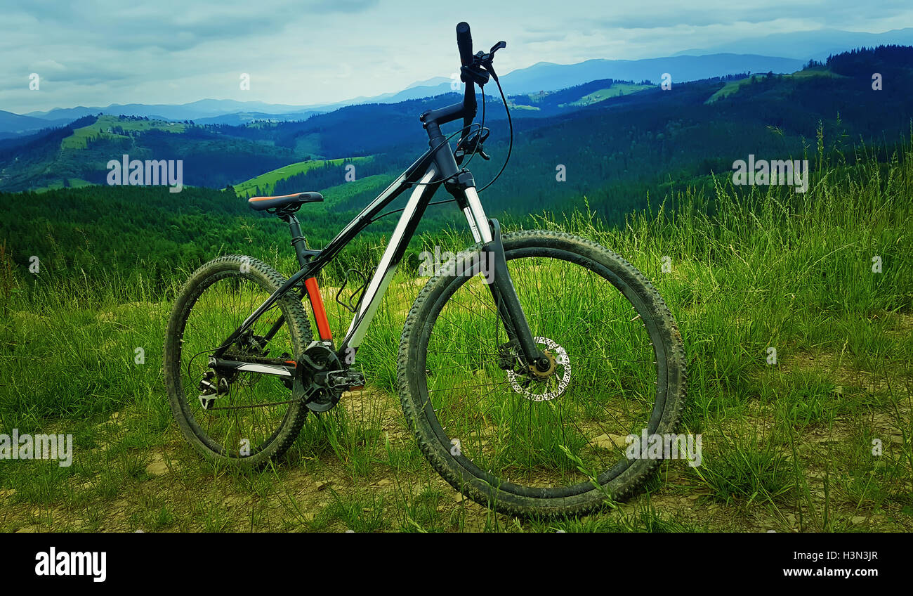 A bicycle over the moutains backround. Biking adventure and traveling symbol. Healthy lifestyle concept Stock Photo