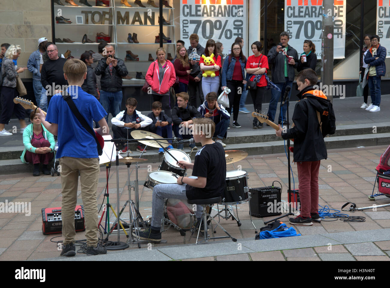 Street musicians  young teenage boys busking on Sauchihall Street, Glasgow Stock Photo