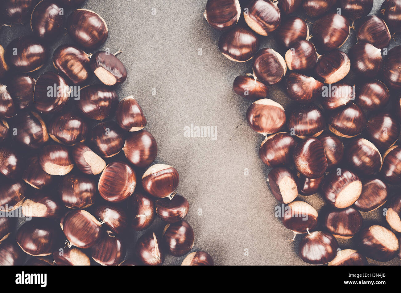 ripe chestnuts on a slate background - seasonal fruits Stock Photo - Alamy