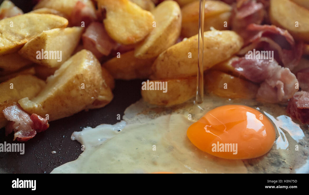 potato fried bacon and eggs Stock Photo - Alamy