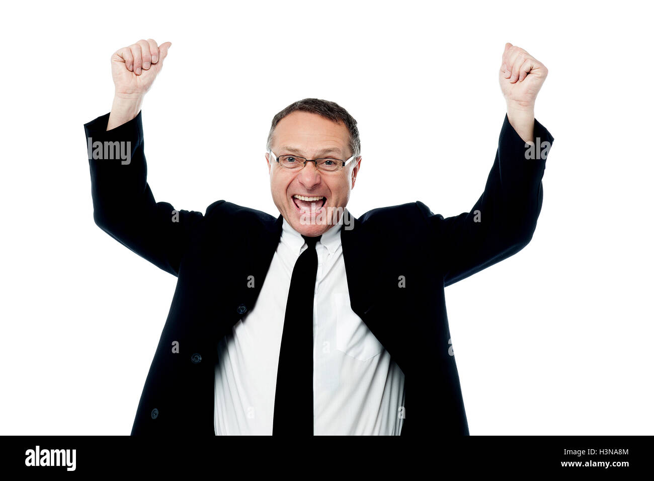 Successful businessman raising his arms Stock Photo - Alamy
