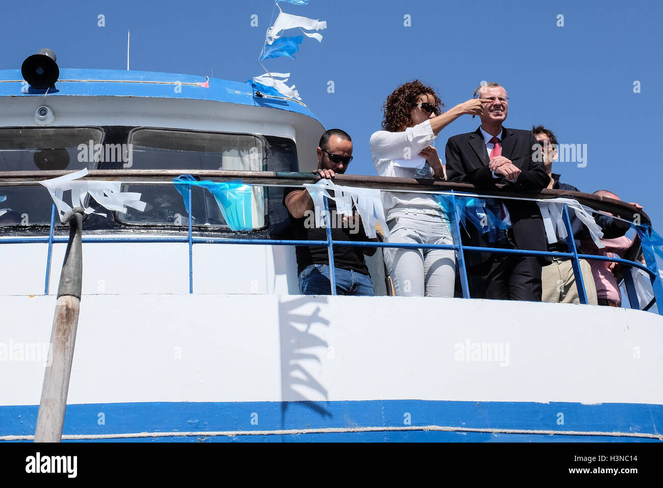 Acre, Israel. 10th October, 2016. A woman seems to be poking the eye of Israeli Tourism Minister YARIV LEVIN on the top deck of the 'Acre Queen' as it concludes its inauguration cruise launching the Haifa-Acre pleasure cruise line at the Acre Marina. The line, which will run on a fixed timetable with several daily cruises, is aimed at domestic and international tourism offering views of the Carmel Mountains, downtown Haifa, along the coast, the colorful and authentic fishing port in Acre and the Acre Marina. Credit:  Nir Alon/Alamy Live News Stock Photo