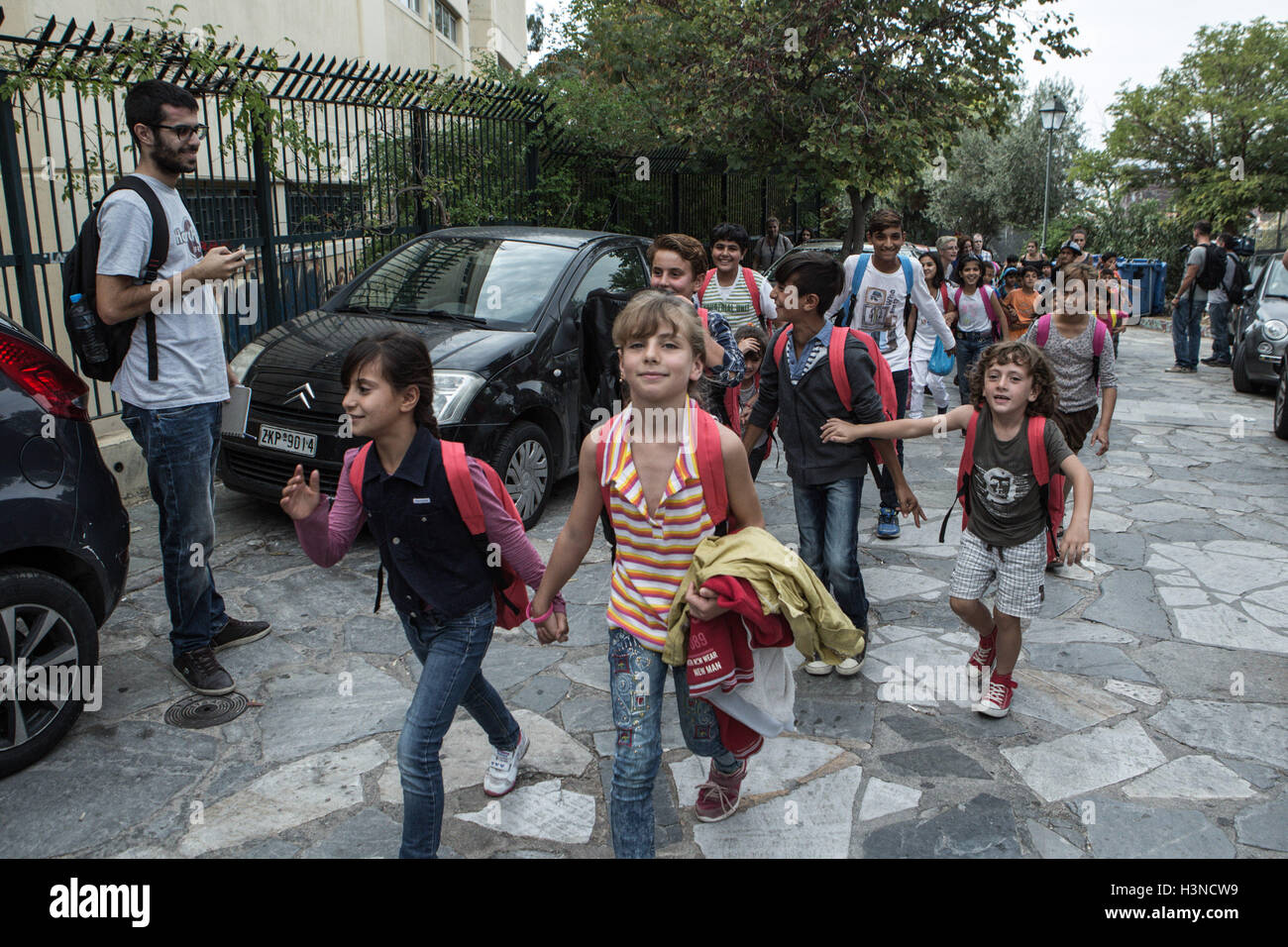 Athens, Greece. 10th Oct, 2016. Refugee children reach a public