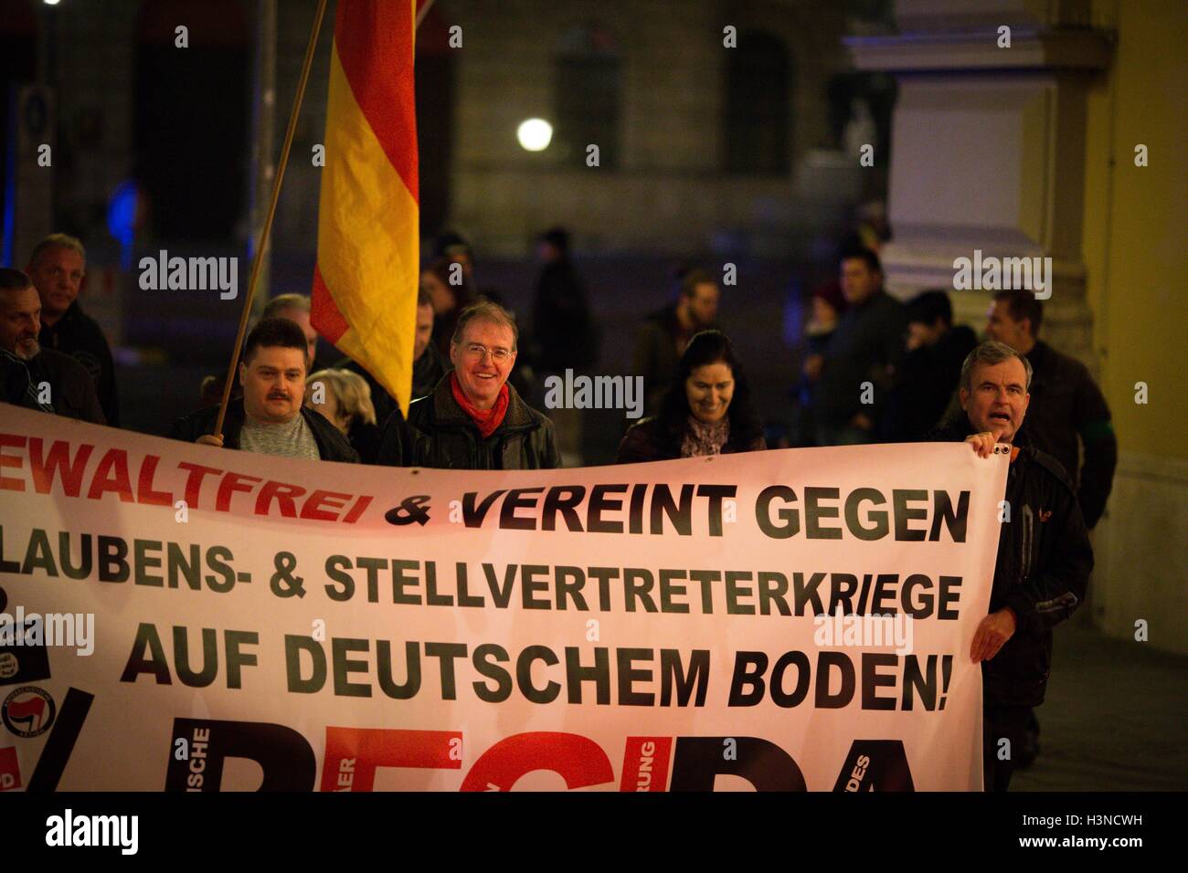 October 10, 2016 - At the front banner: Karl Richter As every Monday PEGIDA gathered once again on October 10th in Munich. Less then one hundred participated came together. Speeches were a mixture of openly displayed racism, confused attempts to explain that Ukrainian Church architecture is more beautiful than protestant and islamic and a relativization of Donald Trumps sexism. Furthermore a small group of neonazis was able to get into the Feldherrnhalle. Rolf H. ""“ known for violent attacks on journalists ""“ prevented a video-documentation of the scene. Convicted neonazi terrorist Karl-Hein Stock Photo