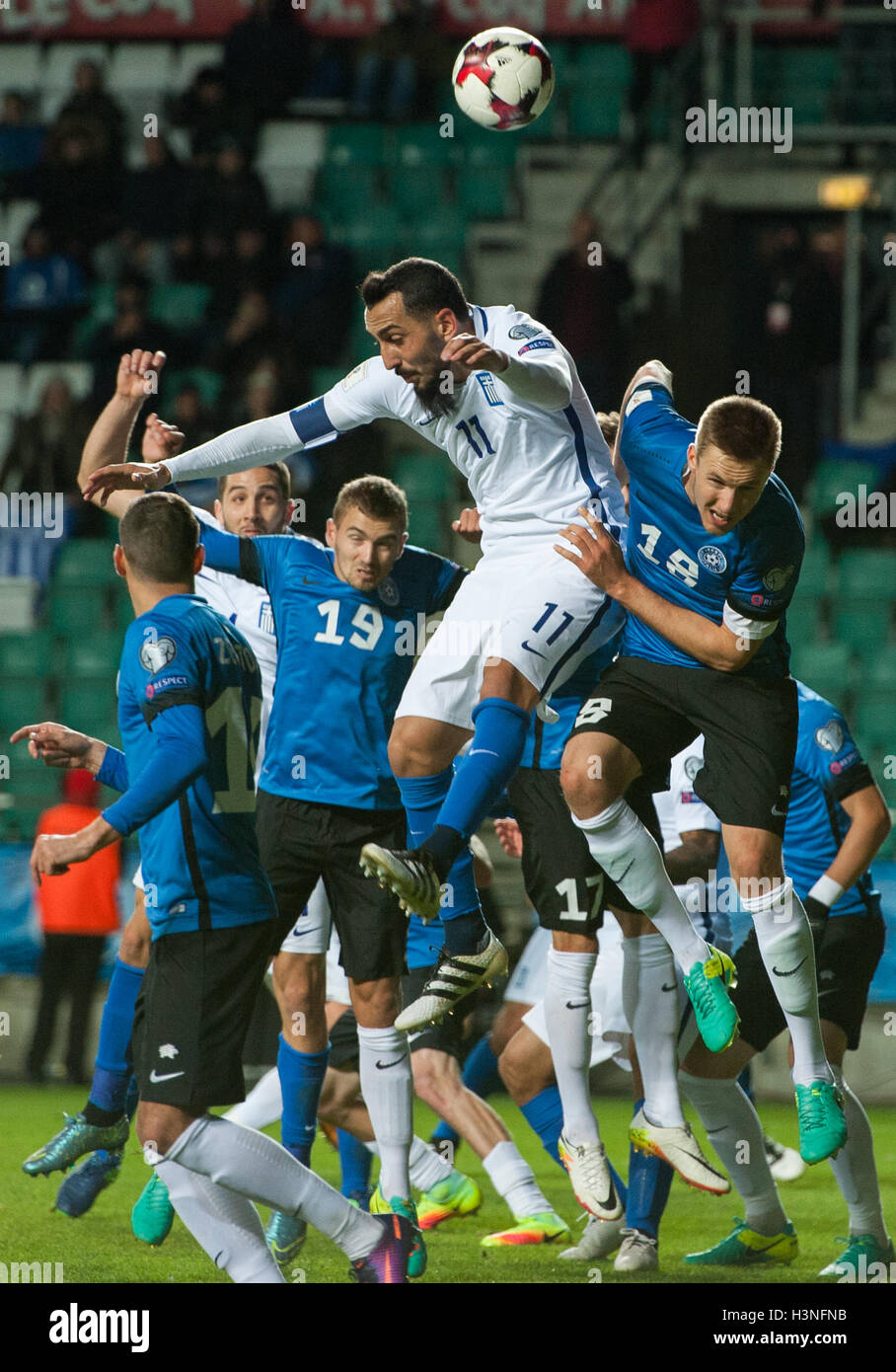 Tallinn, Estonia, 10th October 2016. Karol Mets (R) and Ken Kallaste (2nd L) of Estonia fight for the ball with Kostas Mitroglou (C) of Greece in action during the FIFA World Cup 2018 qualifying match between Estonia and Greece. Credit:  Nicolas Bouvy/Alamy Live News Stock Photo