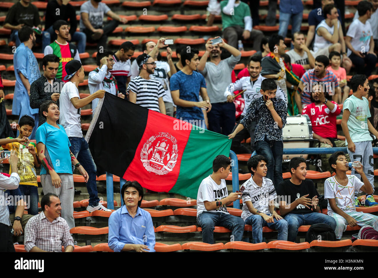 Shah Alam, Malaysia 11th October, 2016. Fans of Afghanistan holding the national flag  during the international friendly match against Malaysia at Shah Alam Stadium Credit:  nufa qaiesz/Alamy Live News Stock Photo