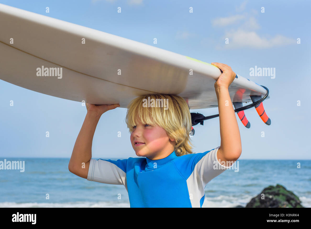 Boys beach carrying hires stock photography and images Alamy