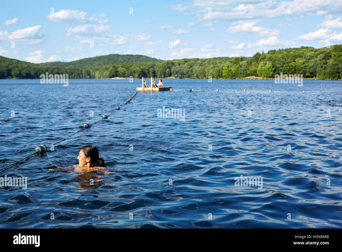 Young woman swimming in Lake Sebago, New York, USA Stock Photo Alamy