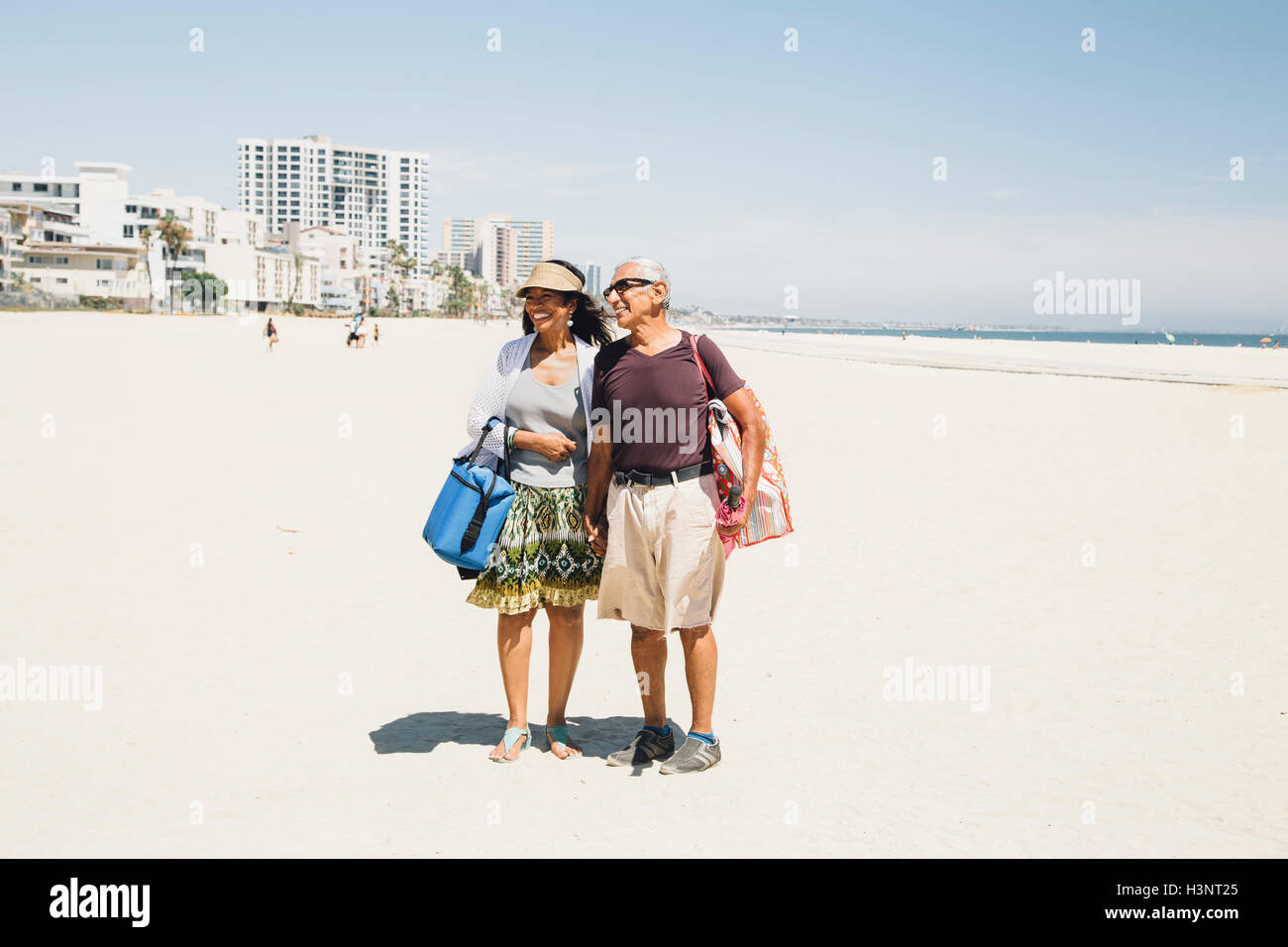 Woman long skirt walking away hi-res stock photography and images - Alamy