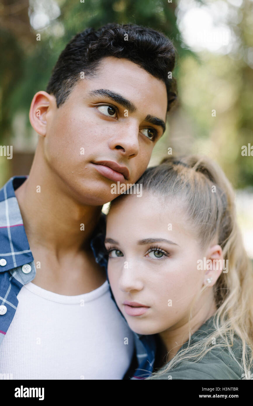 Portrait of young couple hugging Stock Photo - Alamy