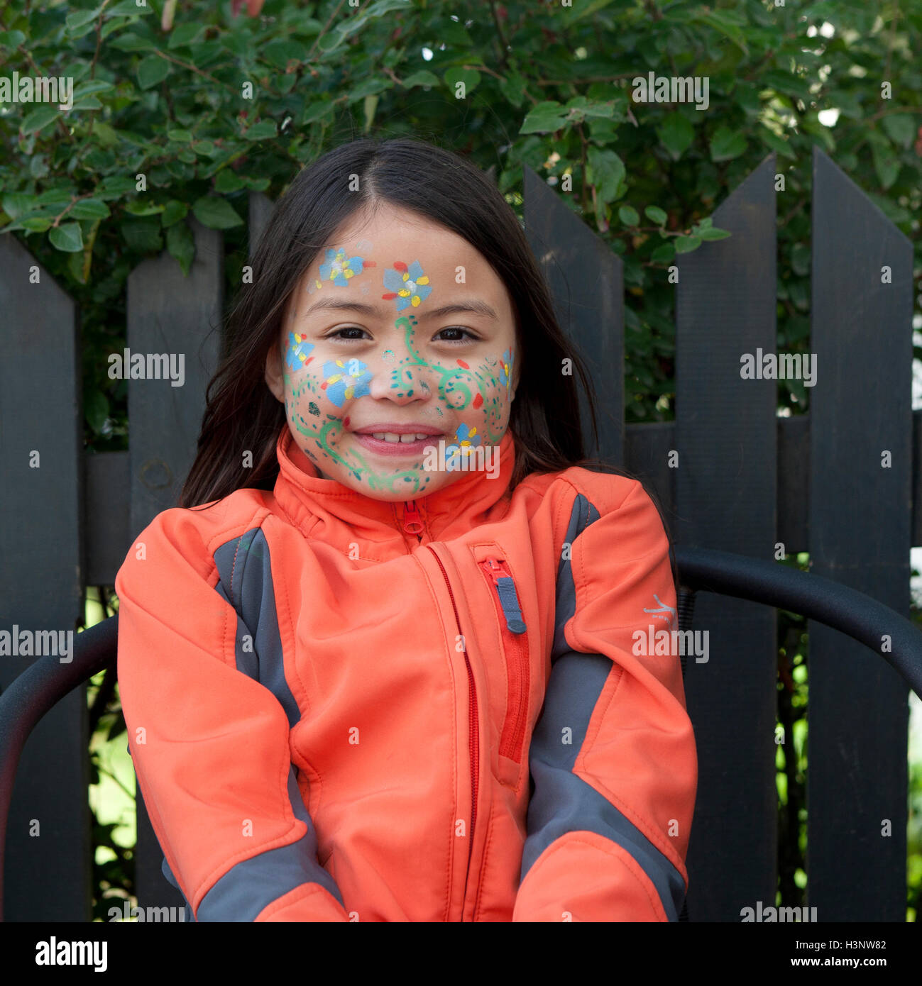 Young girl with painted face during The Cultural Festival in Reykjavik, Iceland Stock Photo