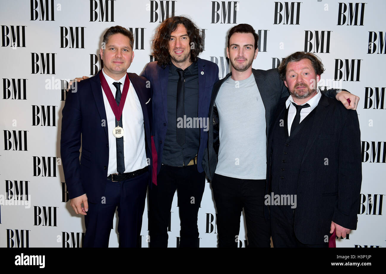 Snow Patrol's Paul Wilson (second right), Jonny Quinn (left), Gary Lightbody (second left) and Tom Simpson (right) attending the BMI London Awards at the Dorchester Hotel, London. Stock Photo
