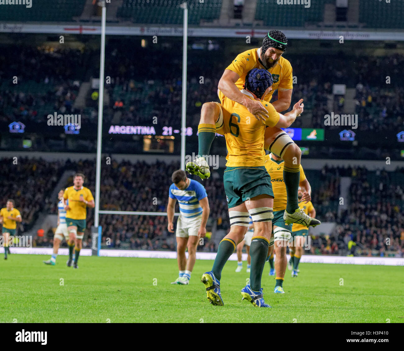 Australian players celebrate Dean Mumm's (6) try during the rugby union ...