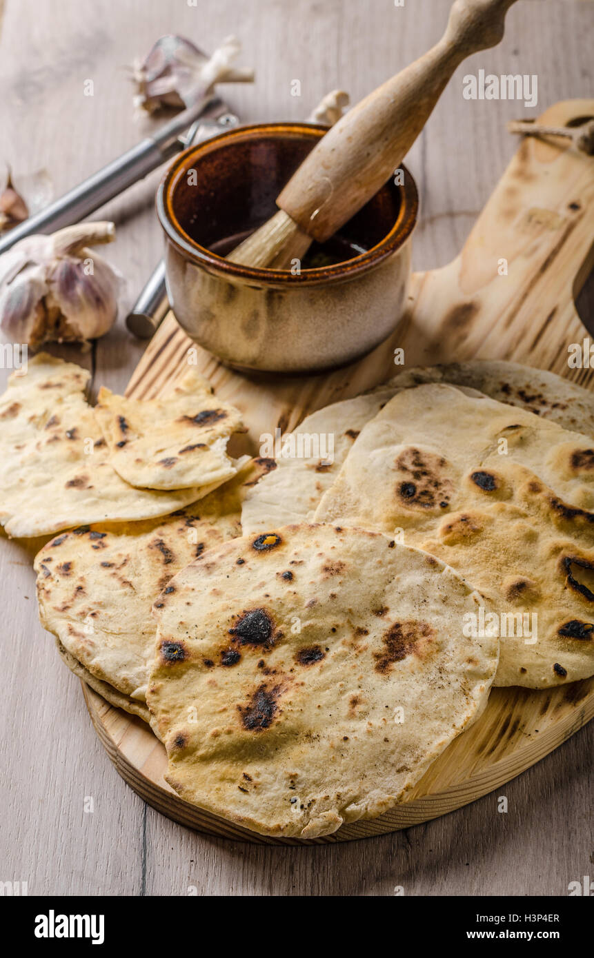 Homemade indian naan bread with garlic sauce, simple and delicious