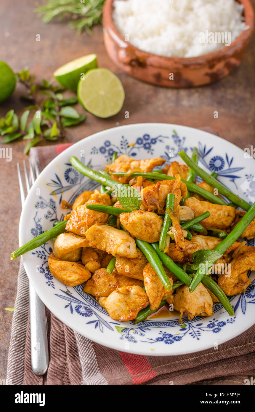 Stir fry chicken, with beans and white rice Stock Photo