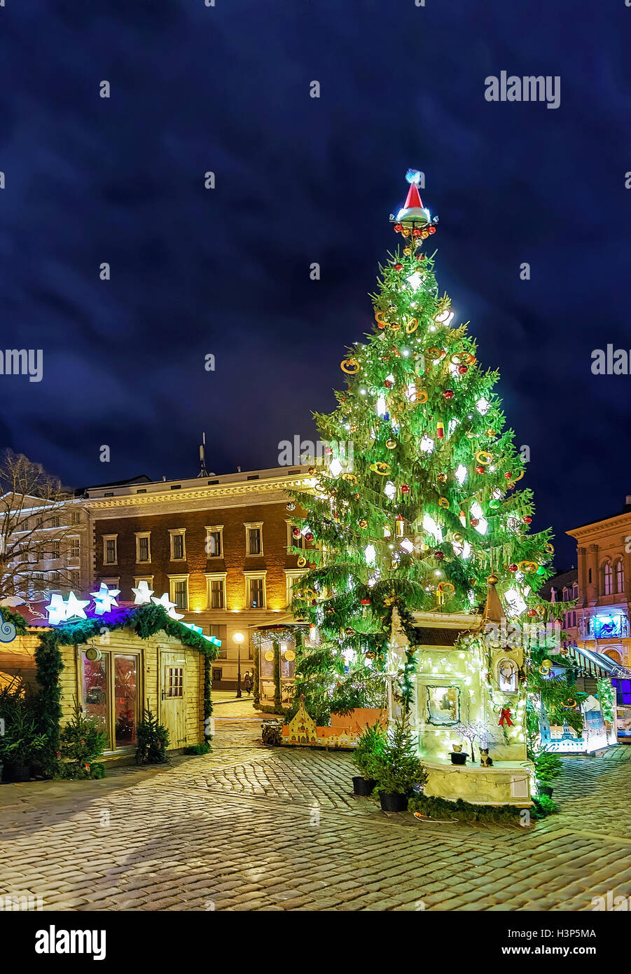 Christmas market and Christmas tree at the Dome square in old Riga, Latvia. The market takes place from the beginning of December till the start of January. Selective focus Stock Photo