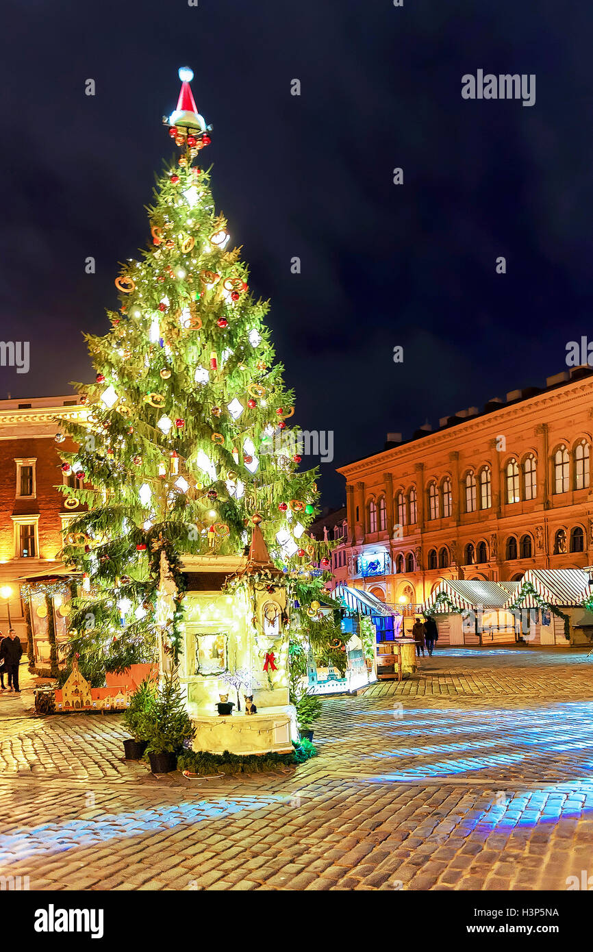Glowing Christmas tree in the night at the Dome square in old Riga