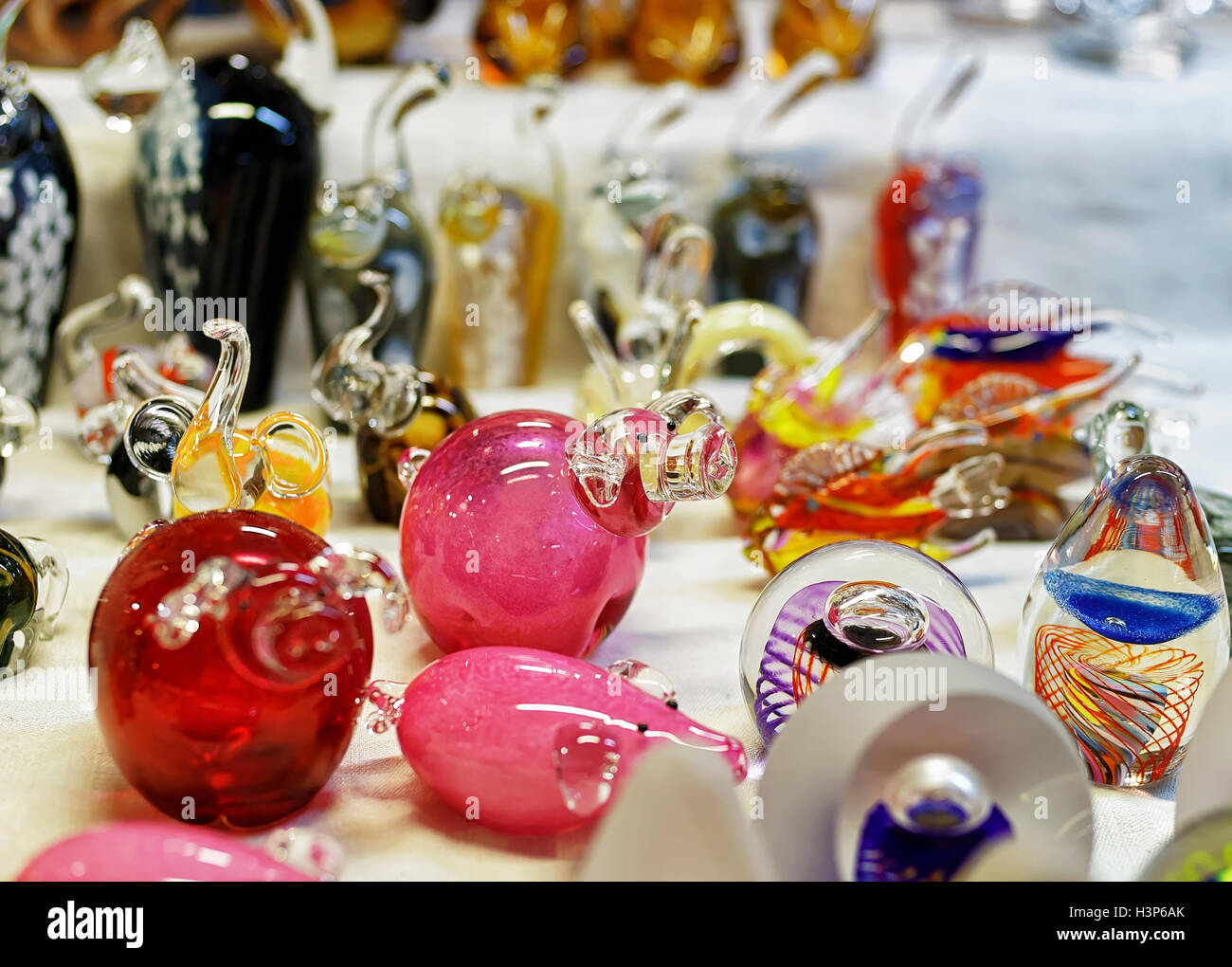 Small glass figurines displayed for sale at the Christmas market in old Riga, Latvia. The market takes place from the beginning of December till the start of January each year. Stock Photo
