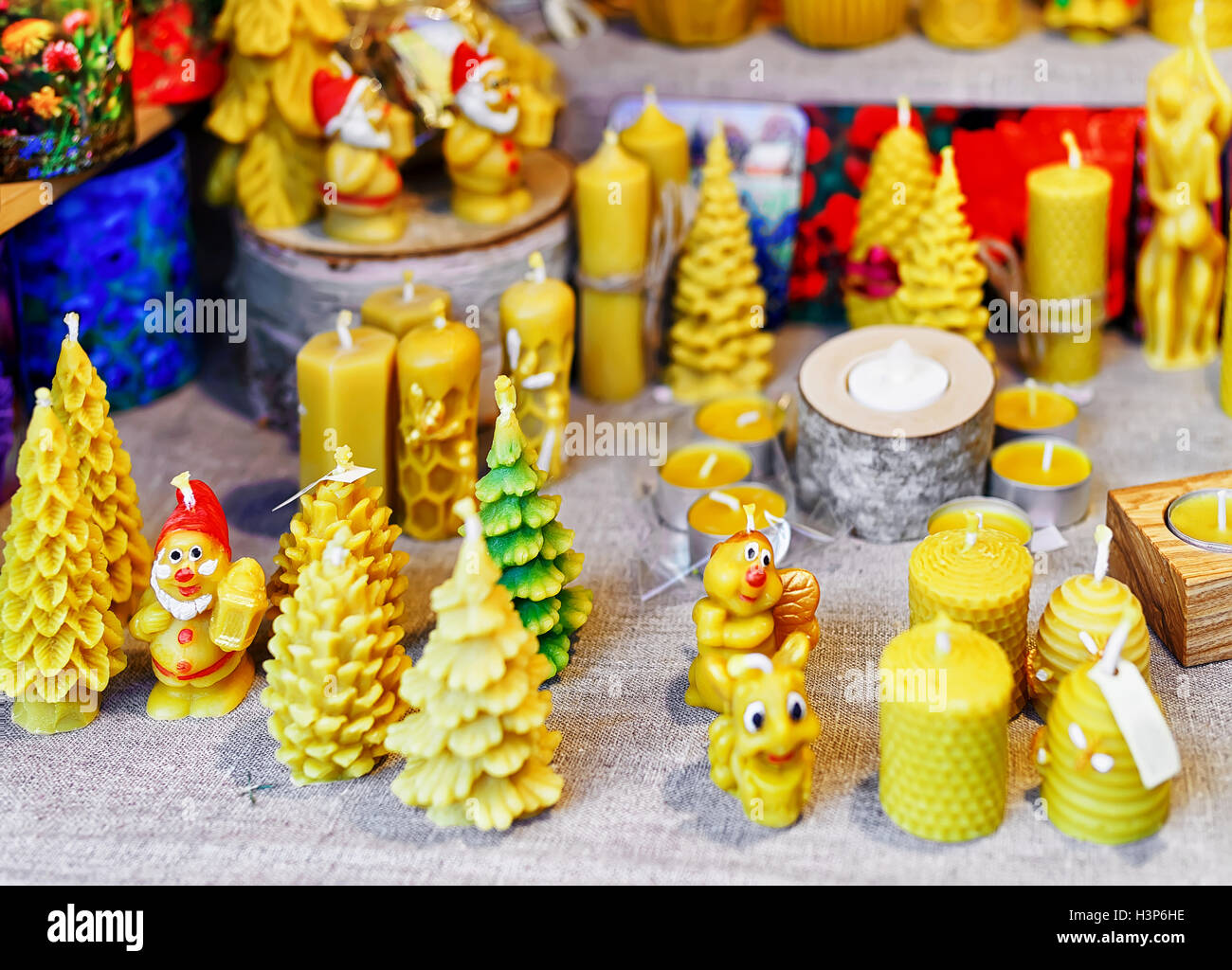 Handmade candles displayed for sale at the stall during the Riga Christmas market in Latvia. The fair takes place from the beginning of December till the start of January. Stock Photo