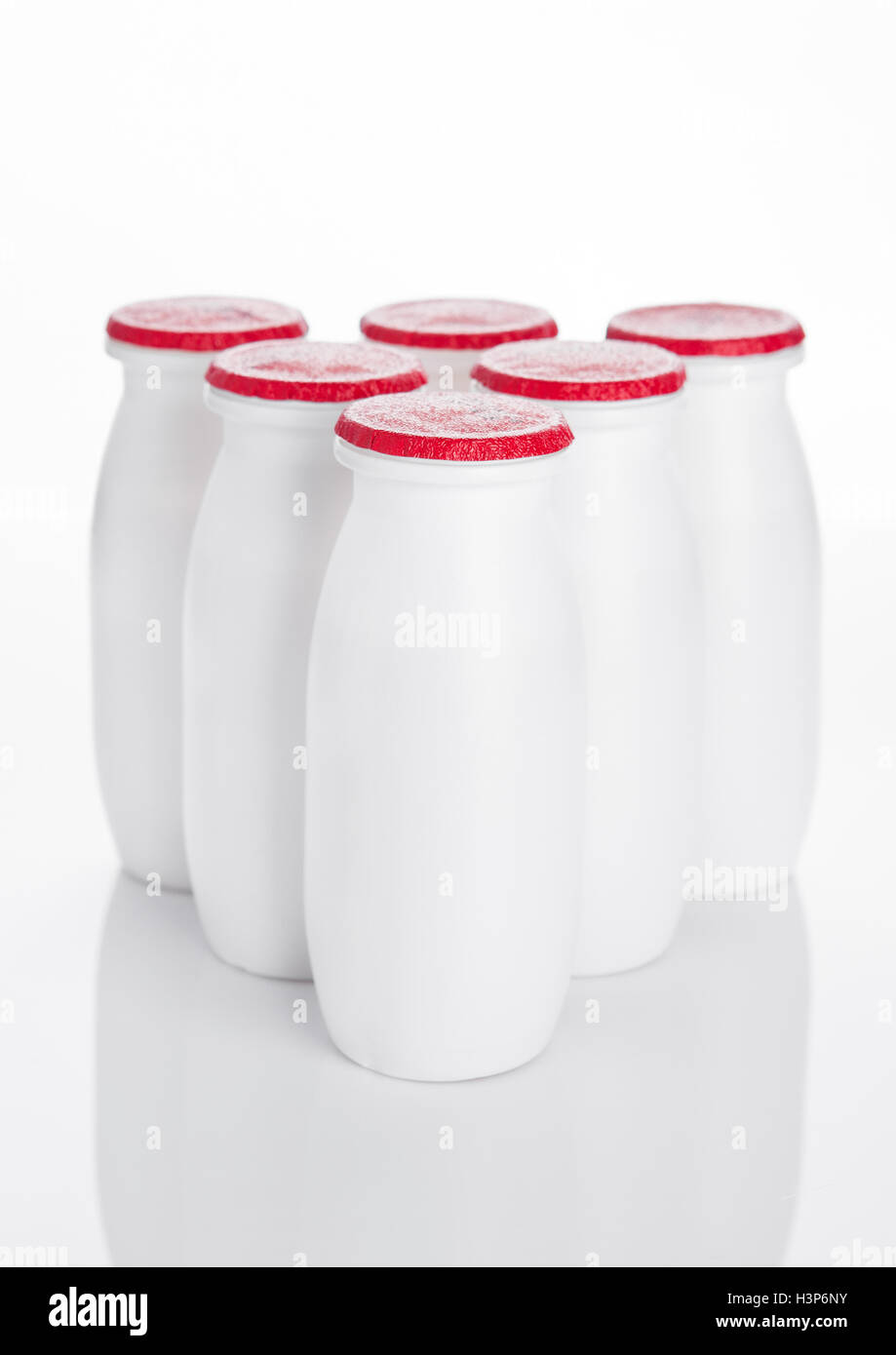 Yogurt containers healthy vitamin drink on white background Stock Photo