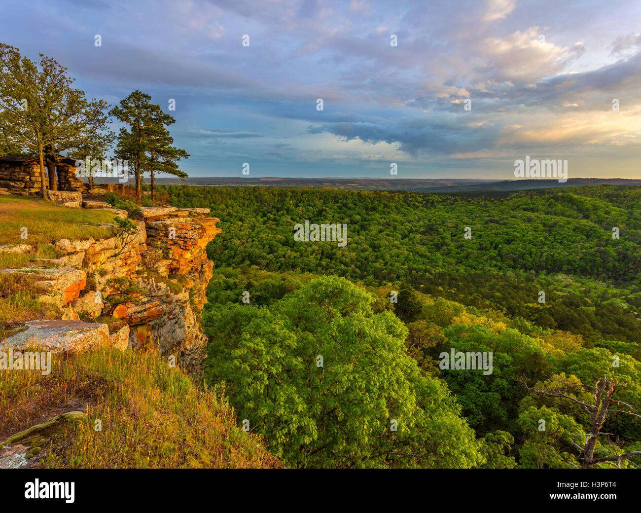 Petit Jean State Park, AR:  Sunset light on lichen covered sandstone cliffs from Cedar Creek Canyon Overlook on Red Bluff Drive Stock Photo