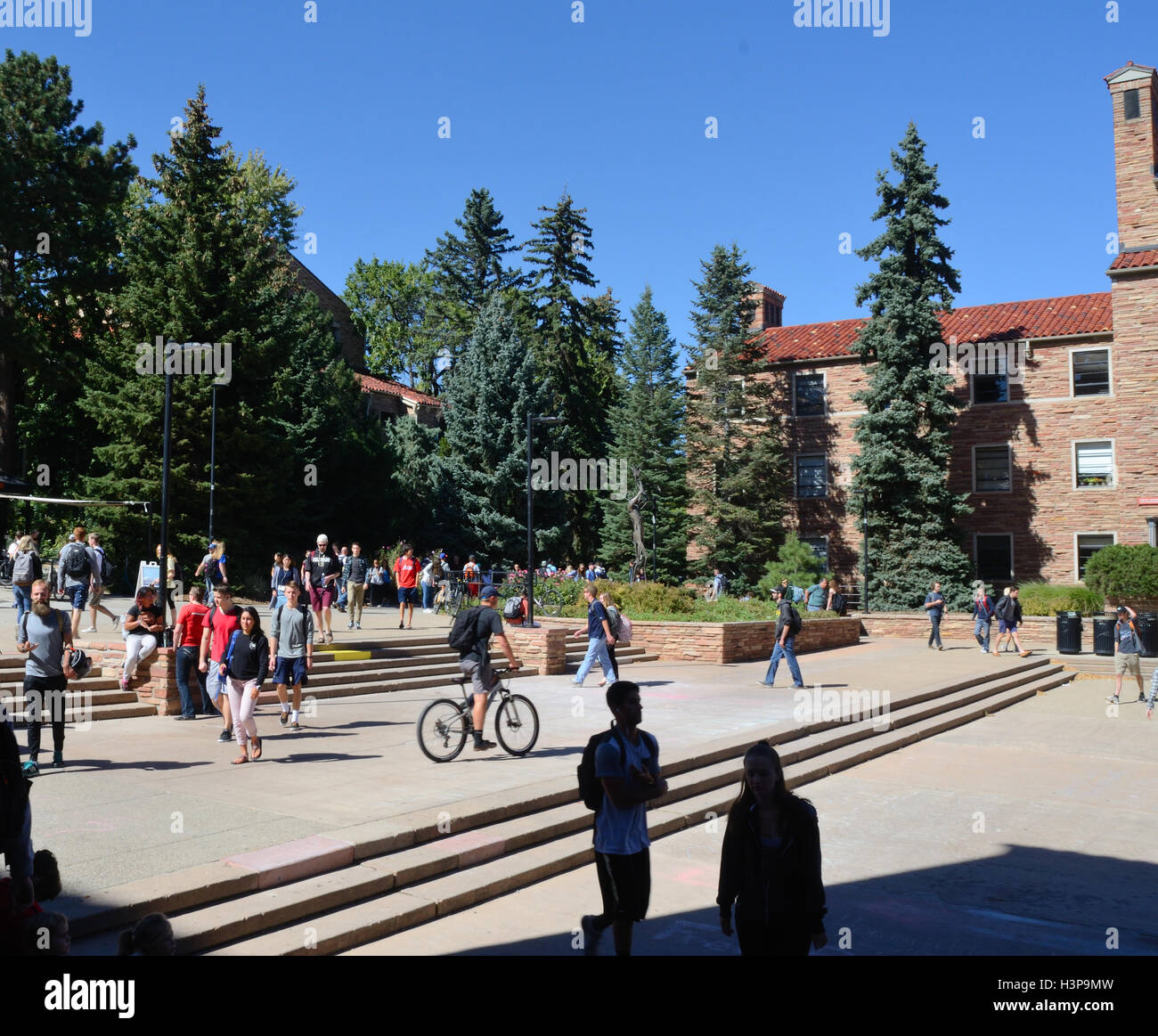 Students at the University of Colorado between classes on a warm, early autumn day. Stock Photo