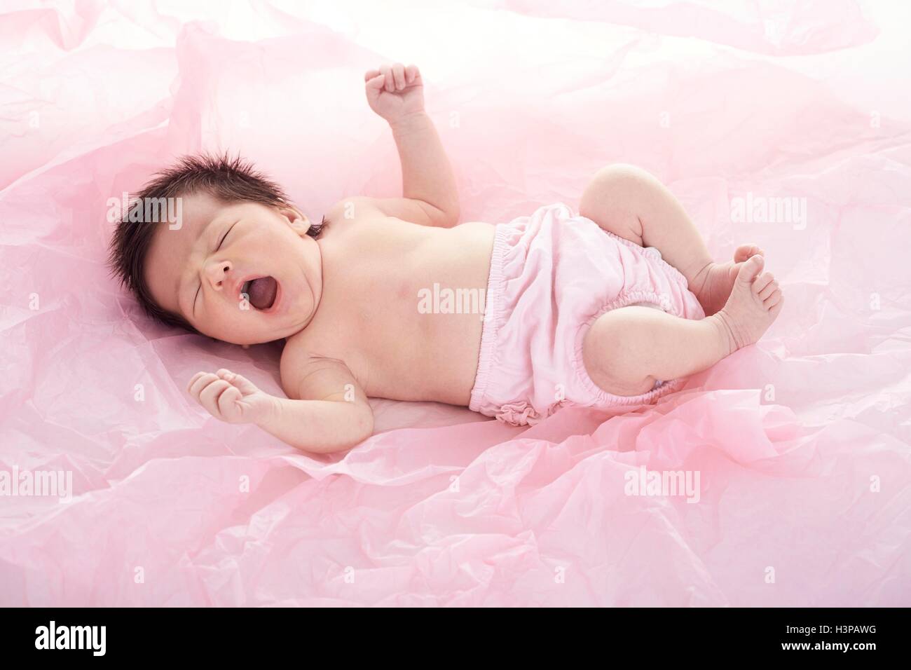 Newborn baby girl yawning hi-res stock photography and images - Alamy