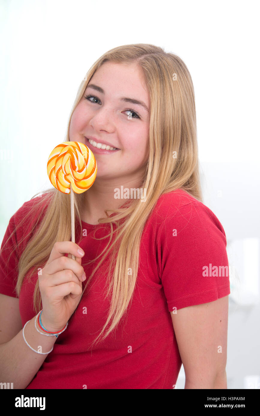 MODEL RELEASED. Teenage girl with lolly pop. Stock Photo