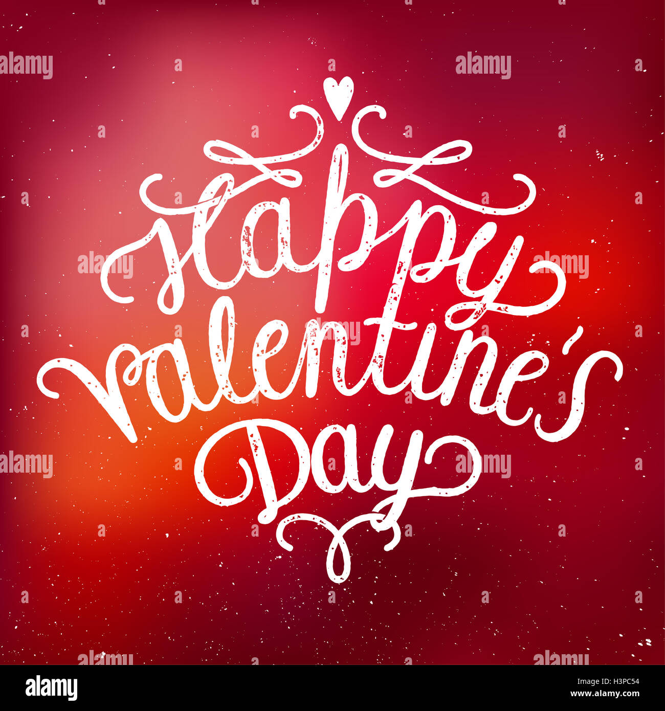 happy valetines day handwritten on a red blurred background Stock Photo