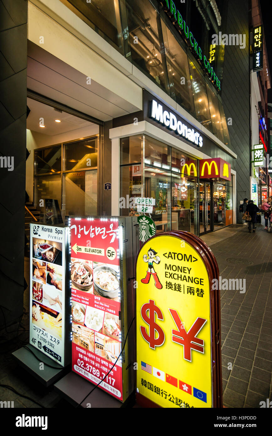 Various signboards in English & Korean in the street of Myeong-dong, Seoul, Korea Stock Photo