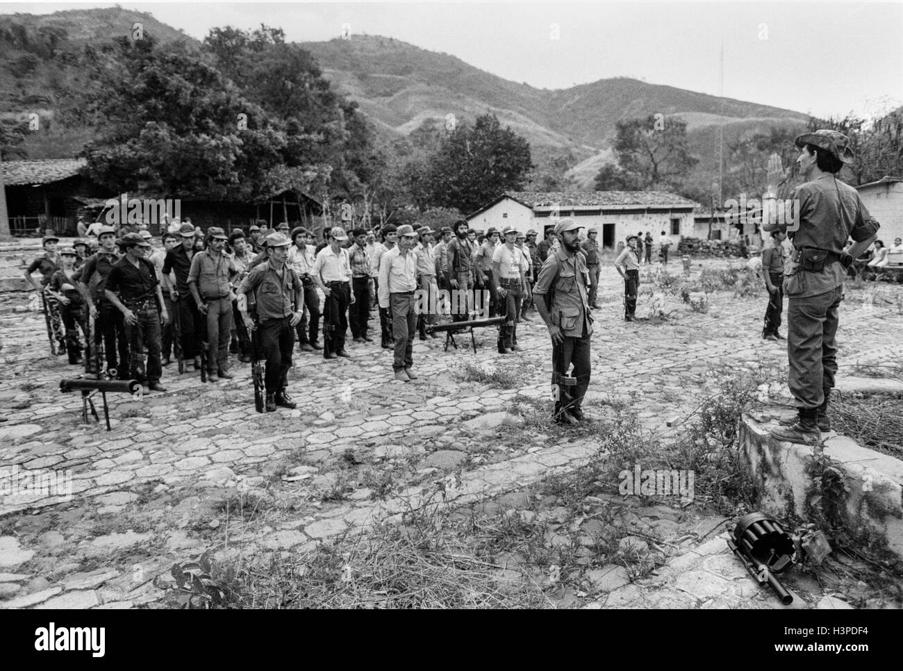 CHALATENANGO,  EL SALVADOR, FEB 1984: - Within the FPL Guerrilla's Zones of Control - Comandante Douglas speaks to some of the guerrillas that had been gathered for an offensive. Stock Photo