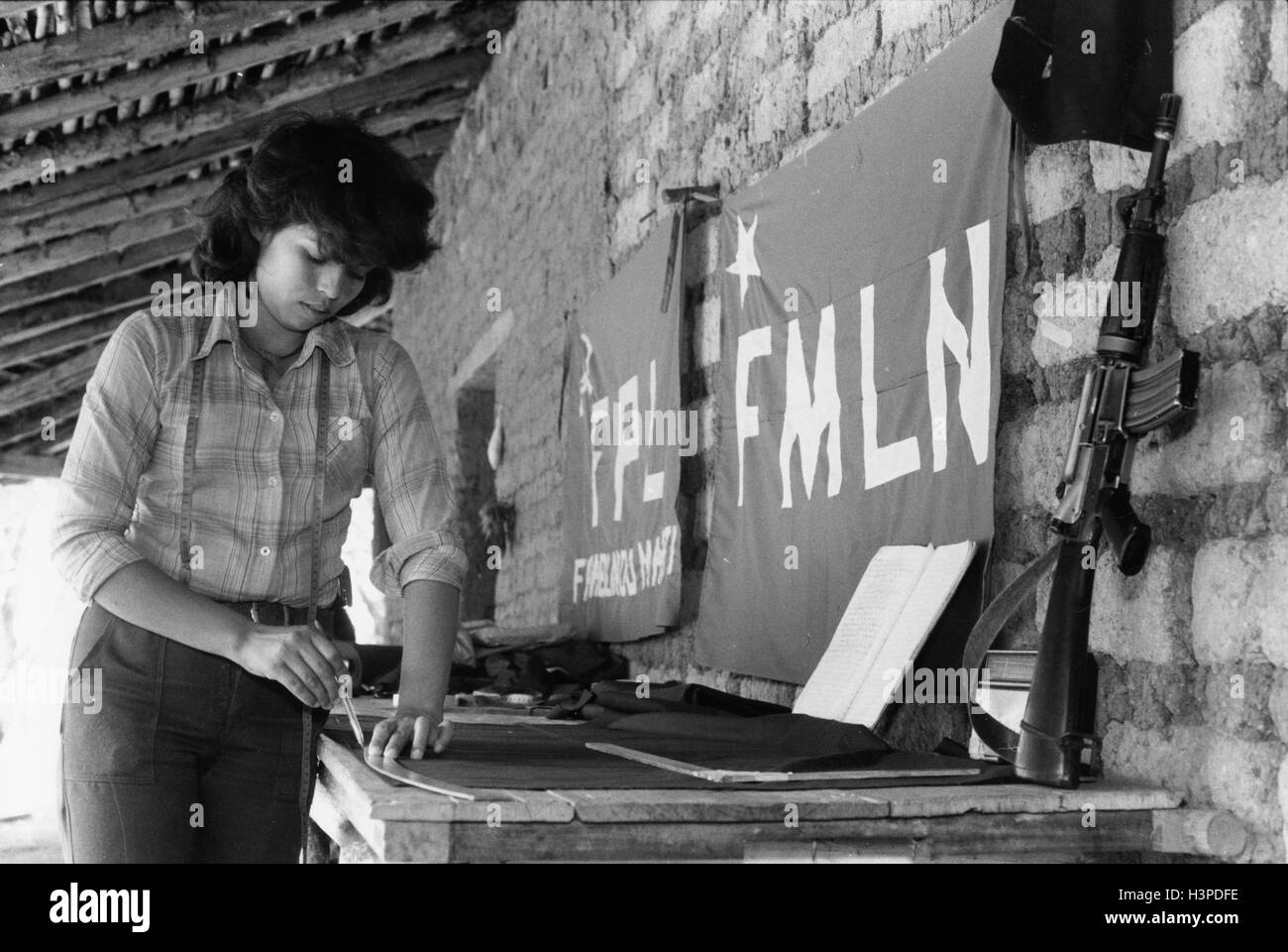 CHALATENANGO,  EL SALVADOR, FEB 1984: - Within the FPL Guerrilla's Zones of Control -  Tereza working in a workshop making uniforms for the guerilla fighters. Stock Photo