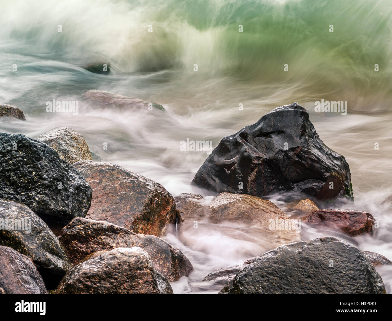 Rocky seashore with stormy sea waves Stock Photo