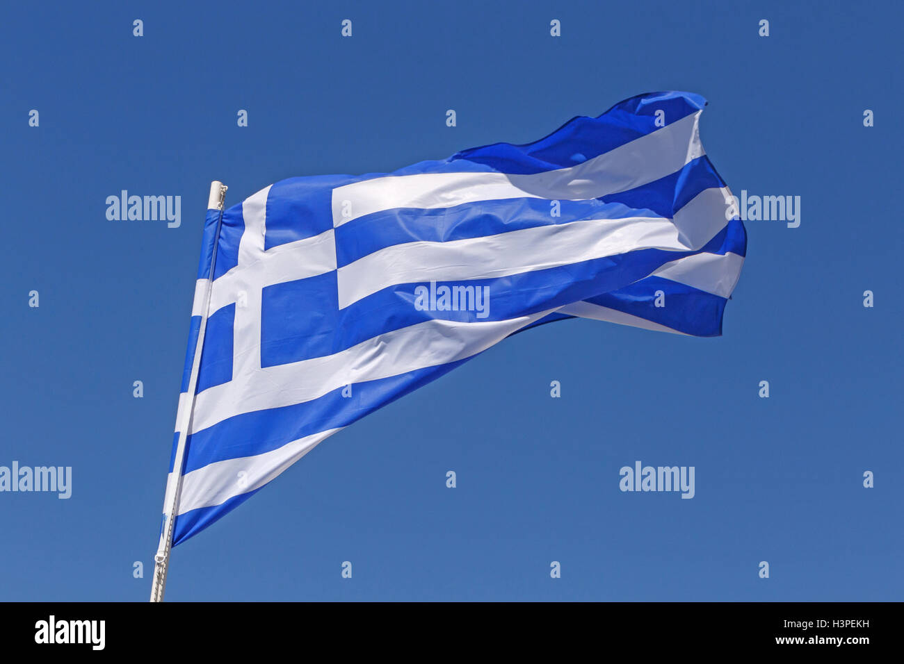 flag of Greece over blue sky Stock Photo