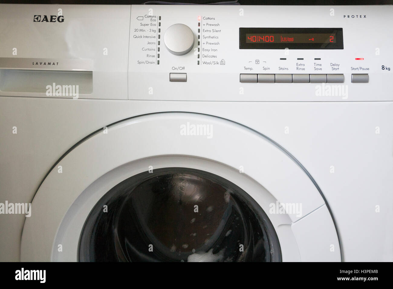 Energy efficient AEG Washing machine finishing a load of cotton garments  end of washine cycle drum still spinning for impeccable laundry results  Stock Photo - Alamy