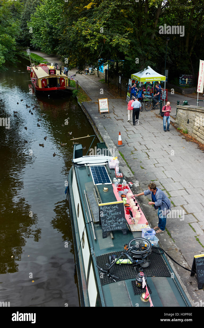 Hand painted gifts being sold from narrowboat at Saltaire on the Leeds and Liverpool canal Stock Photo