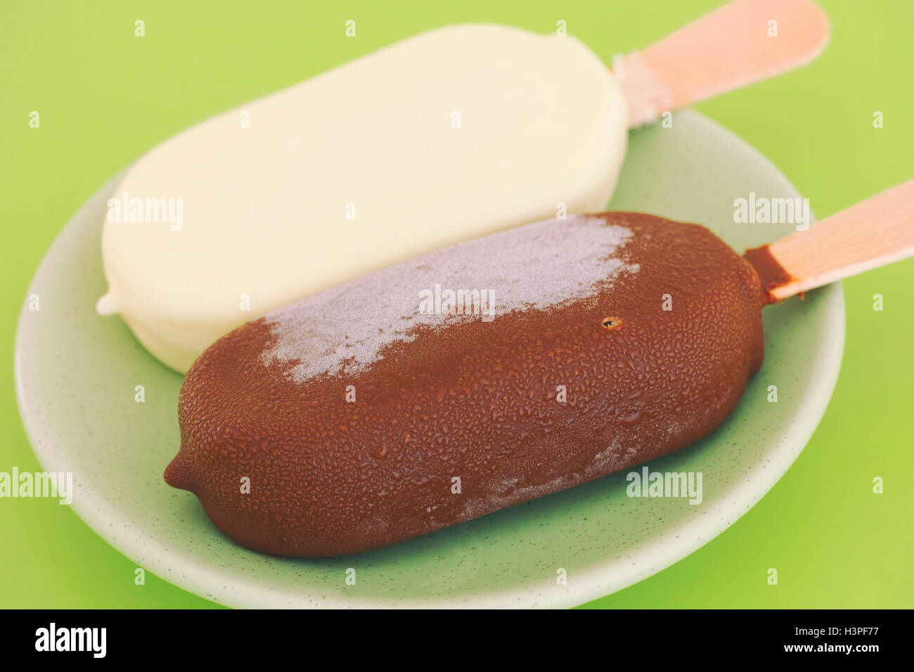 Two chocolate ice cream popsicles. Brown and white chocolate. Stock Photo