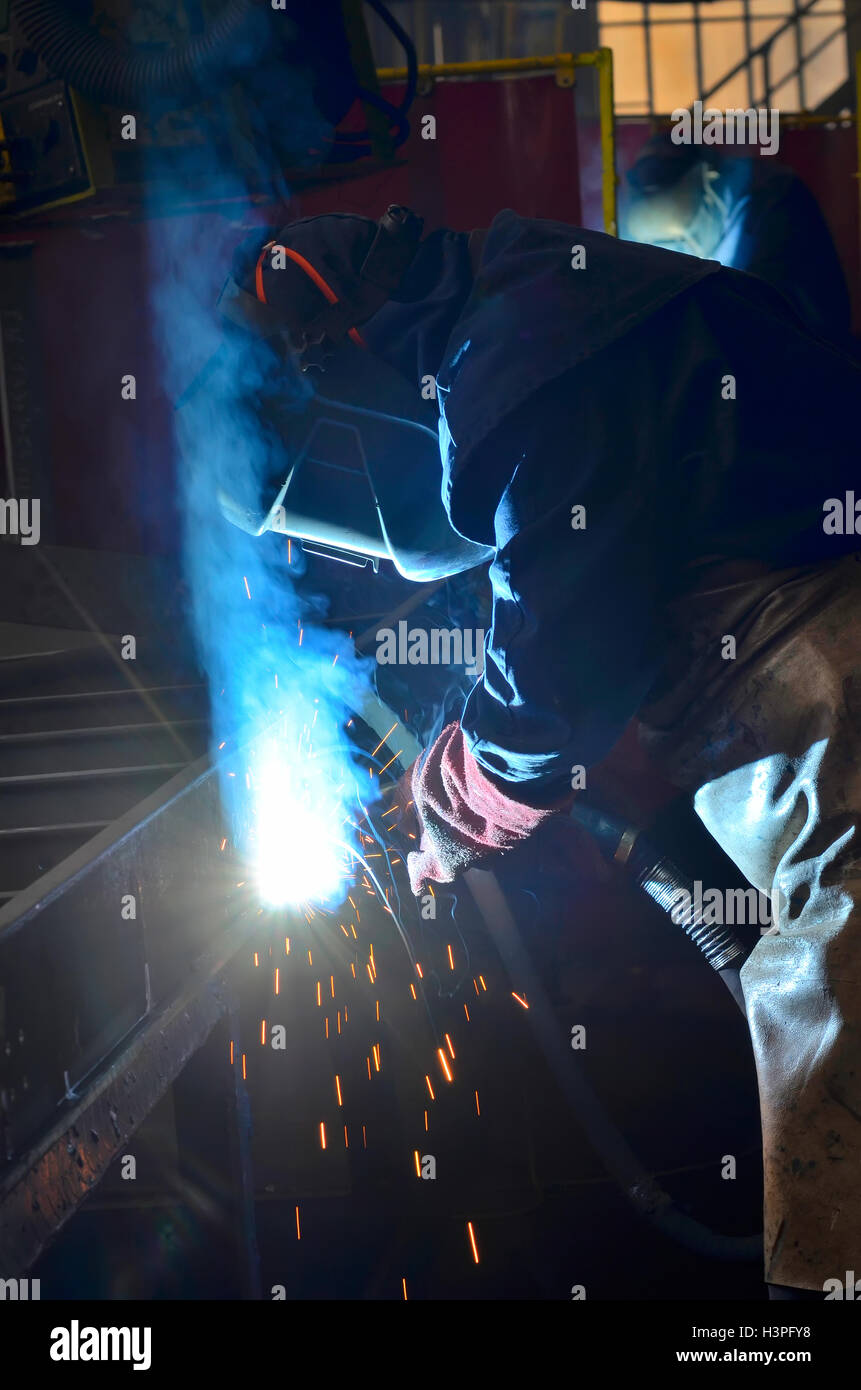 welder welding with mig-mag method Stock Photo
