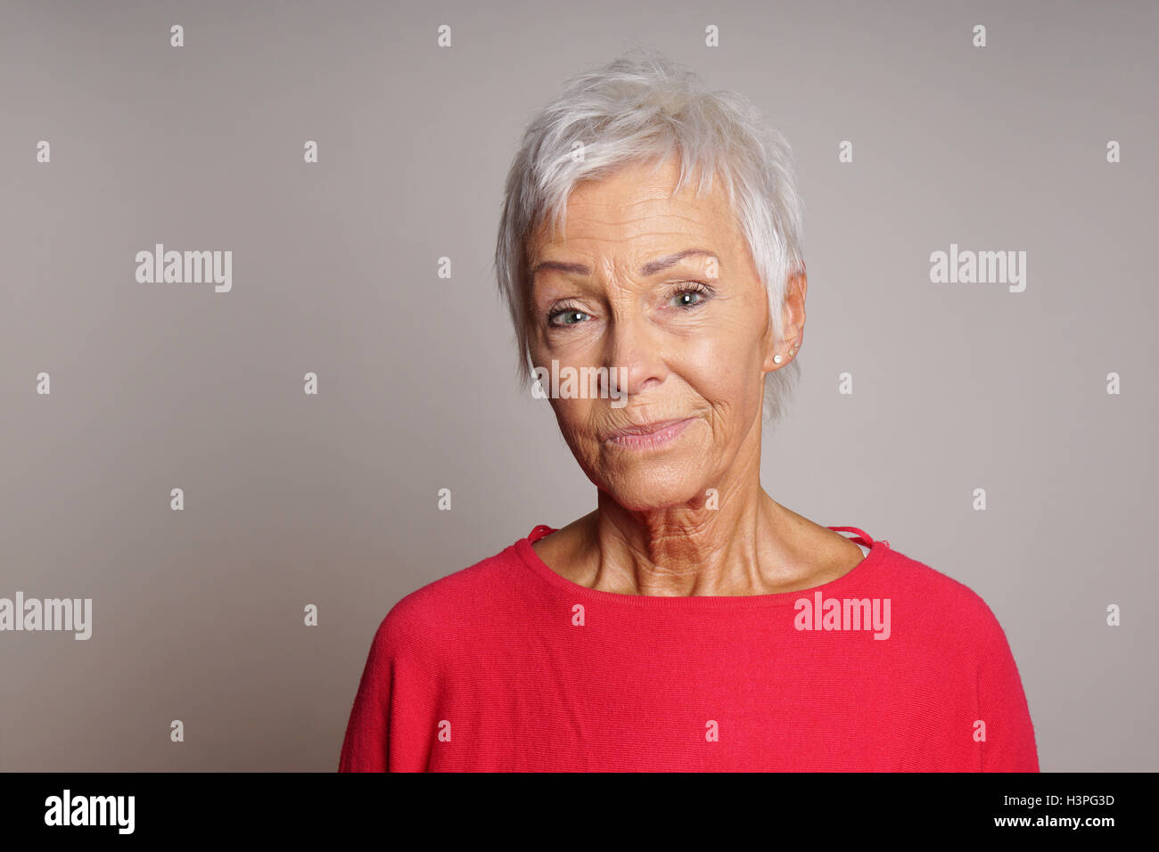 mature woman with skeptical look on her face Stock Photo